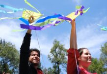 People holding kites