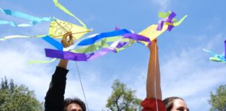 People holding kites