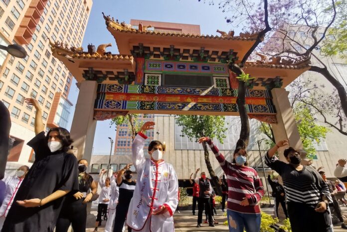 People perform a Taichi class in Plaza Santos Degollados, in the Center, as part of the outdoor activities that have been organized for the arrival of spring