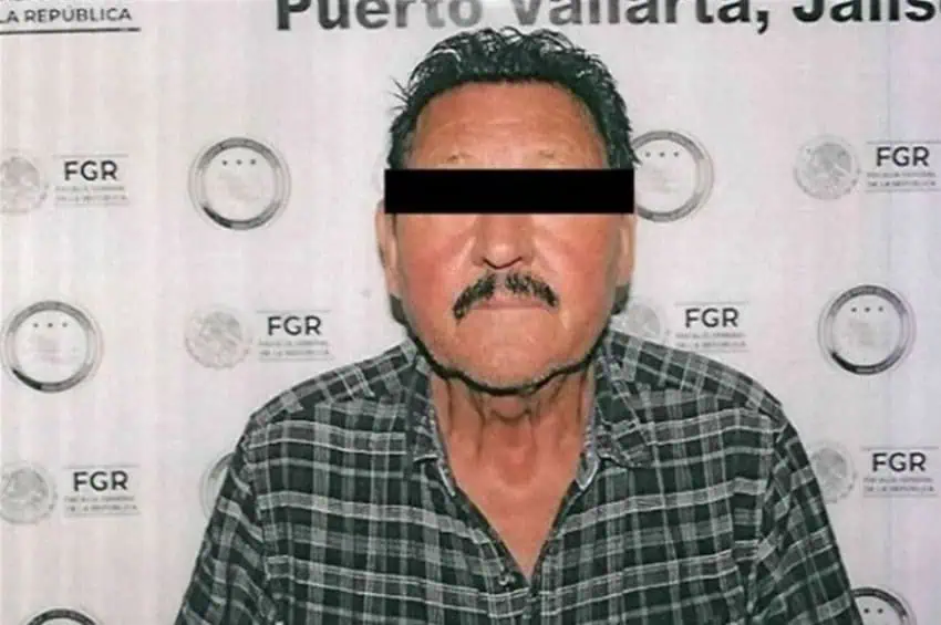 A police mug shot of a mustached Canadian man arrested in Puerto Vallarta with his eyes blacked out for privacy