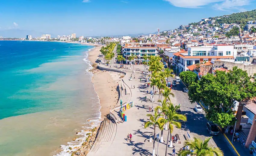 Cobblestone streets and colorful façades travel live successful PV's Malecón.