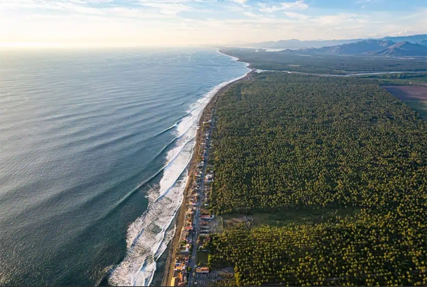 An aerial view of waves peeling down the coast of Pascuales in Colima Mexico