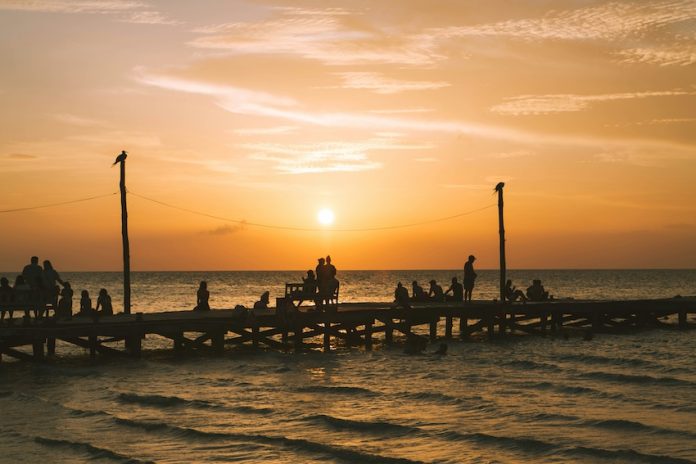 A beautiful sunset in Holbox island's wooden pier.