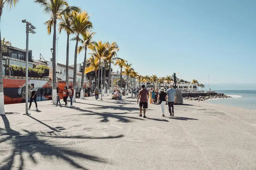 People walk leisurely near the beach in Puerto Vallarta, Jalisco, Mexico.