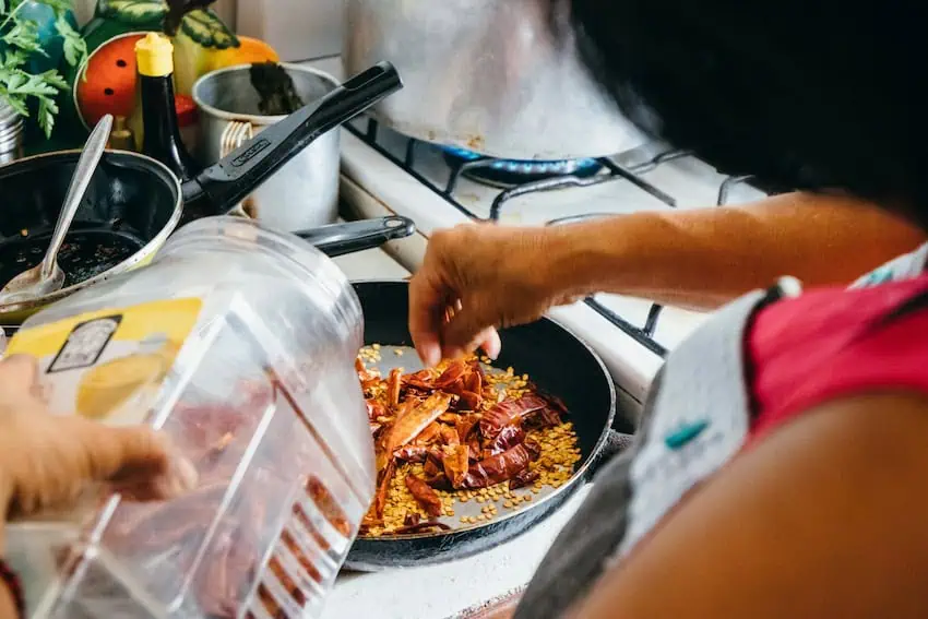 A woman preparing food in a Mexican kitchen