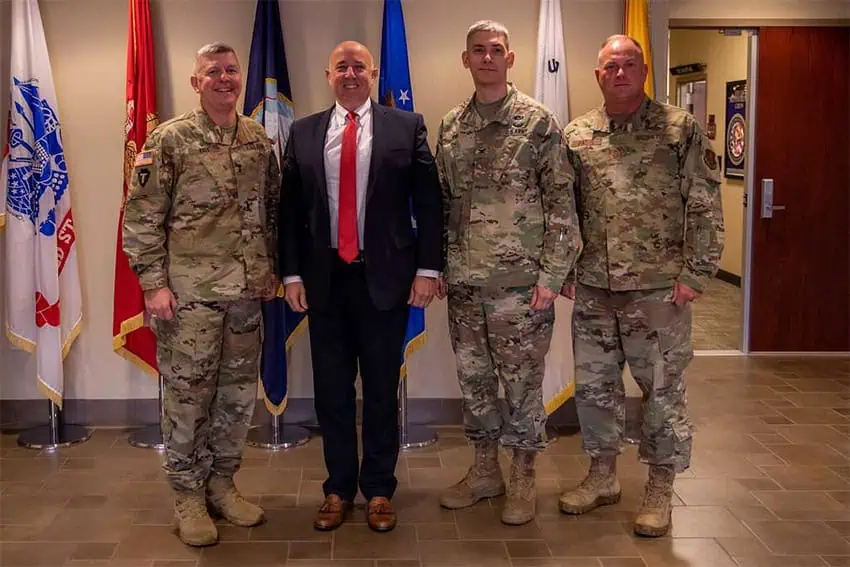 Acting U.S. Secretary of Defense Robert Salesses stands with a group of U.S. soldiers, like those he deployed to the Mexico border