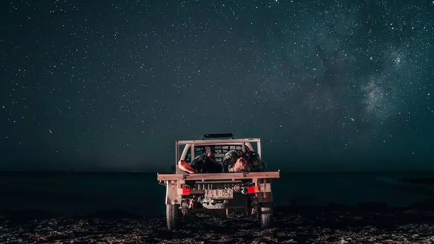 A couple watching the stars on the beach