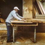 An old carpenter works on his next artifact