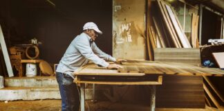 An old carpenter works on his next artifact