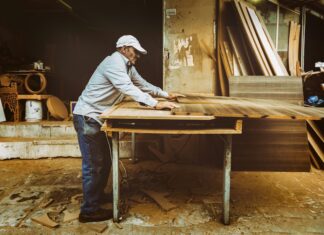 An old carpenter works on his next artifact