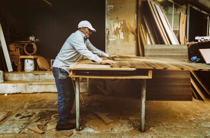 An old carpenter works on his next artifact