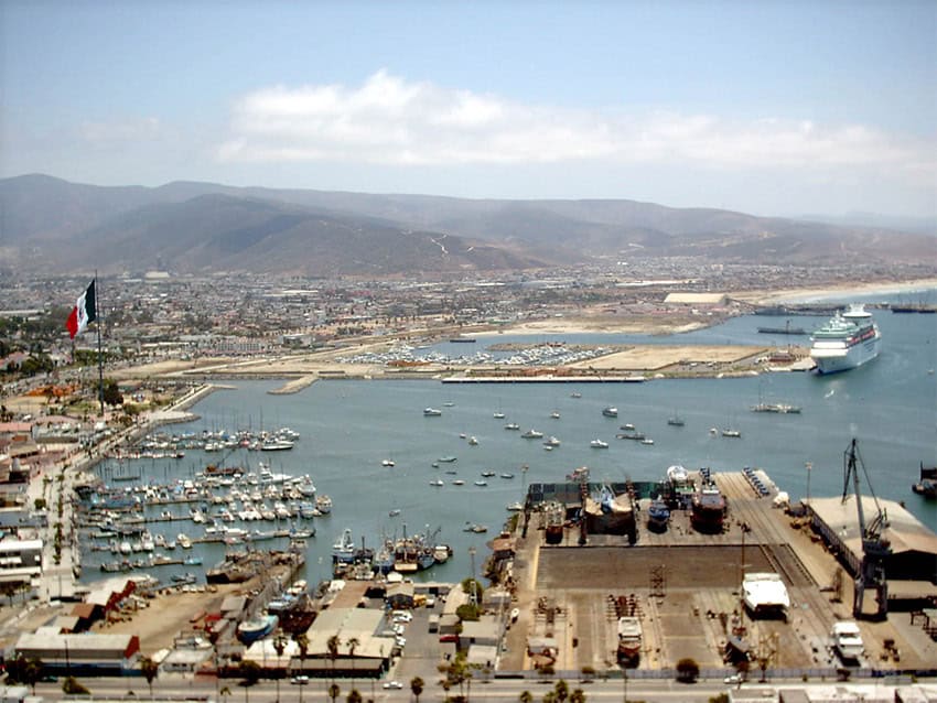 An aerial view of the port of Ensenada, with a cruise ship at dock