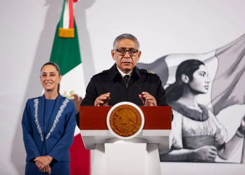 Mexico's Navy Minister Raymundo Morales Àngles stands behind the presidential podium speaking to reporters at President Sheinbaum's daily press conference.