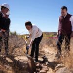 President Claudia Sheinbaum in Durango, ceremonially shoveling a pile of debris as part of a tour of a new water treatment plant coming online near Durango city, Mexico, in March.