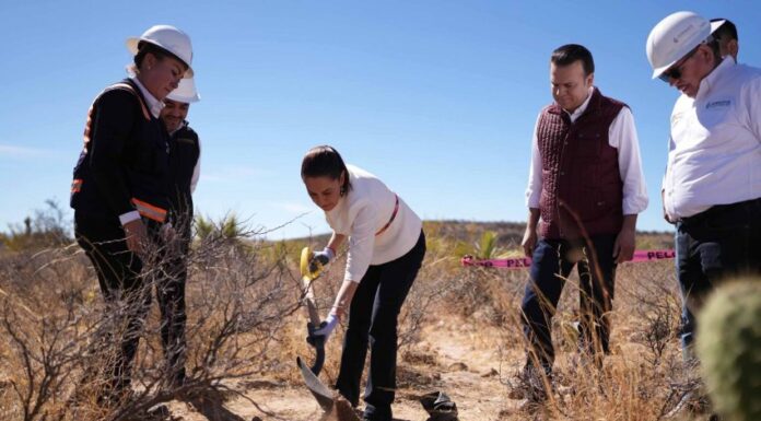 President Claudia Sheinbaum in Durango, ceremonially shoveling a pile of debris as part of a tour of a new water treatment plant coming online near Durango city, Mexico, in March.