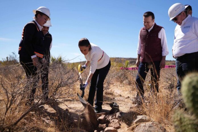 President Claudia Sheinbaum in Durango, ceremonially shoveling a pile of debris as part of a tour of a new water treatment plant coming online near Durango city, Mexico, in March.