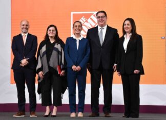 President Sheinbaum and the Home Depot Mexico CEO stand on a stage to announce the company's investment in Mexico