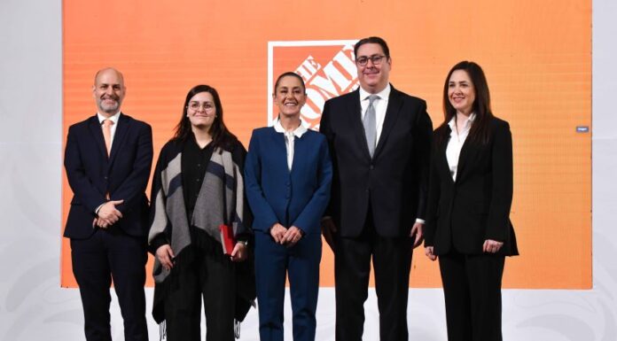 President Sheinbaum and the Home Depot Mexico CEO stand on a stage to announce the company's investment in Mexico