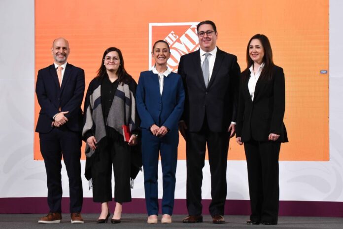 President Sheinbaum and the Home Depot Mexico CEO stand on a stage to announce the company's investment in Mexico