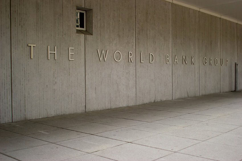 A wall on the World Bank building in Washington D.C. The long horizontal wall has letters spelling "The World Bank Group" on it.