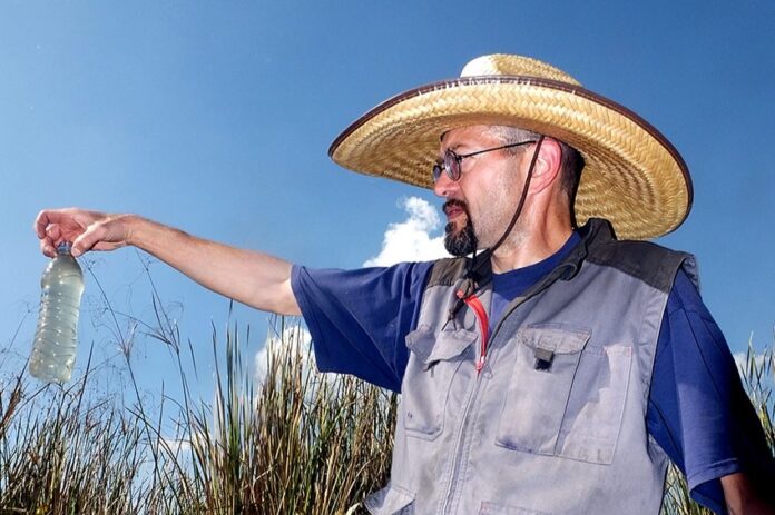 A man points at the Casa Blanca wetlands