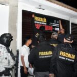 México state authorities close a barbershop in an anti-crime raid