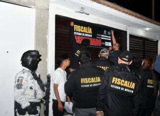 México state authorities close a barbershop in an anti-crime raid