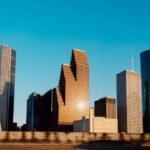 Houston city skyline, with closeups of skyscrapers of various shapes.