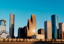 Houston city skyline, with closeups of skyscrapers of various shapes.