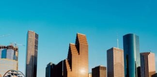 Houston city skyline, with closeups of skyscrapers of various shapes.