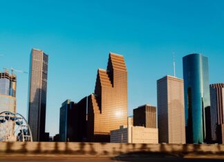 Houston city skyline, with closeups of skyscrapers of various shapes.