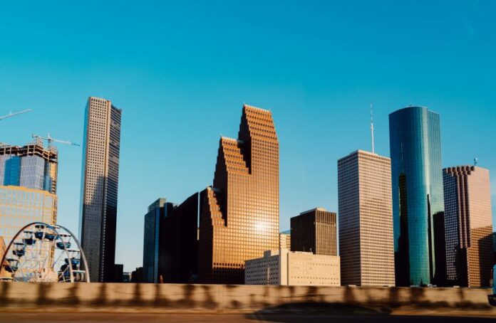 Houston city skyline, with closeups of skyscrapers of various shapes.