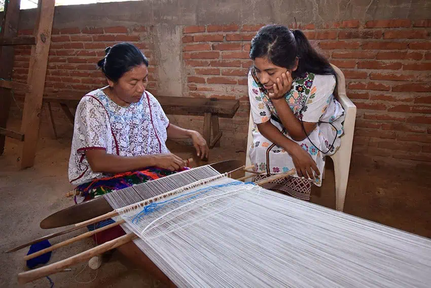 Amusgo weavers in Guerrero use a backstrap loom to weave traditional textiles, similar to the Oaxaca designs that U.S. brands are accused of taking via cultural appropriation