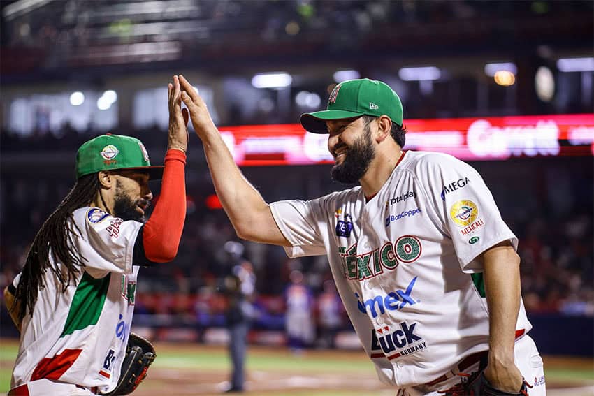 Two Mexican baseball players high-five