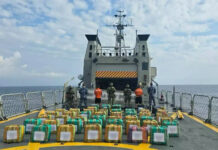 Navy members display drug packages after a Chiapas cocaine bust