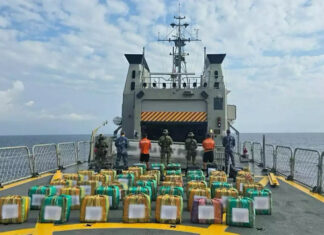 Navy members display drug packages after a Chiapas cocaine bust