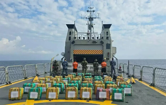 Navy members display drug packages after a Chiapas cocaine bust