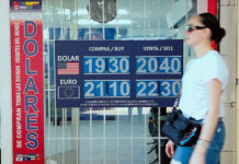 A Mexico City sign showing the value of the Mexican peso, which lost value against the US dollar after a US employment report