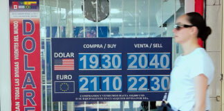 A Mexico City sign showing the value of the Mexican peso, which lost value against the US dollar after a US employment report