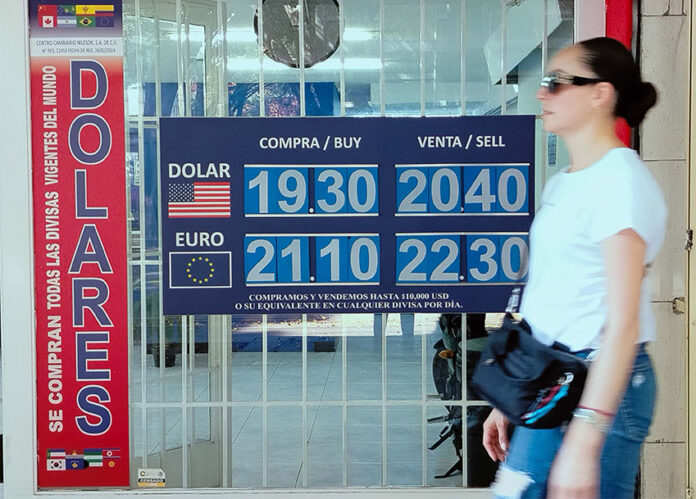 A Mexico City sign showing the value of the Mexican peso, which lost value against the US dollar after a US employment report