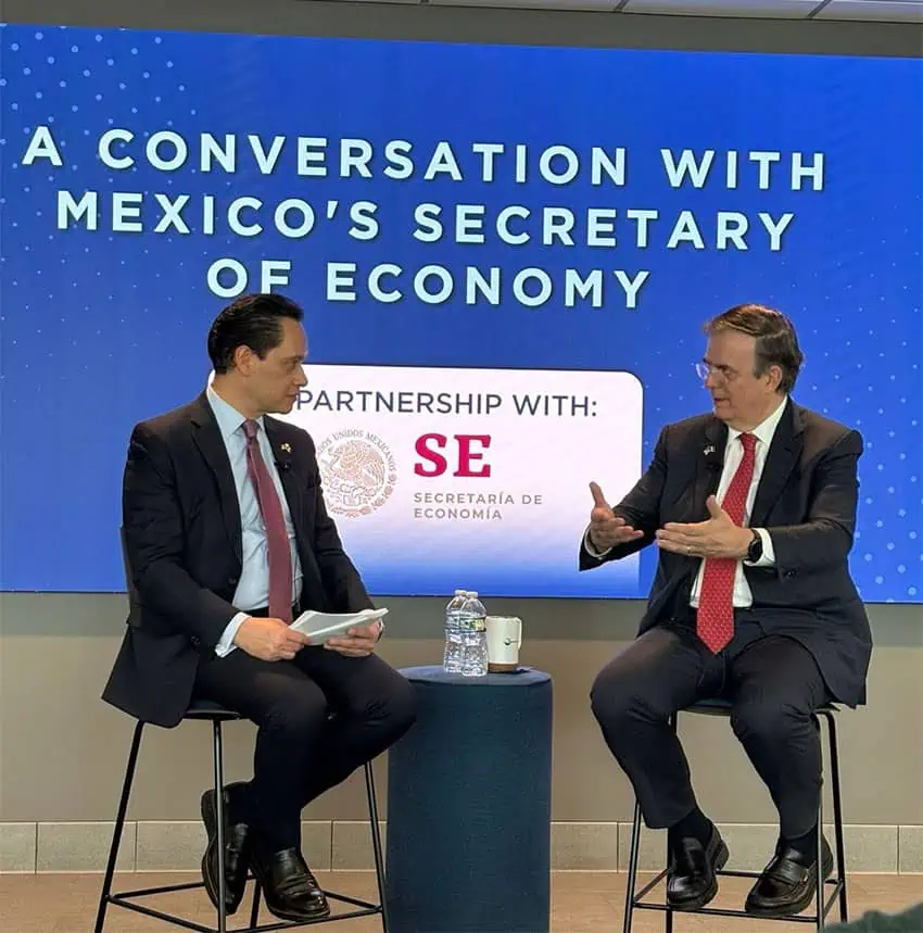 Marcelo Ebrard talks about tariffs in front of a screen reading "A conversation with Mexico's Secretary of Economy"