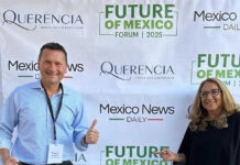 Travis and Tamanna Bembenek stand smiling in front of a banner reading Mexico News Daily, Querencia and Future of Mexico