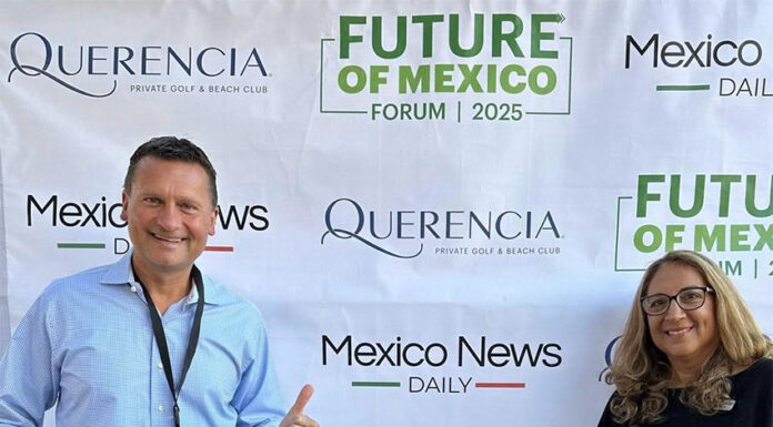 Travis and Tamanna Bembenek stand smiling in front of a banner reading Mexico News Daily, Querencia and Future of Mexico