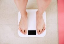 A woman standing on some scales