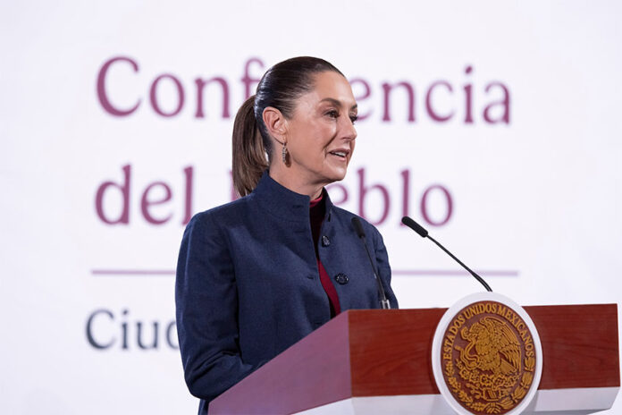 President Sheinbaum at the podium of her Monday mañanera conference, where she discussed Ebrard's plans to attend tariff talks in the U.S.