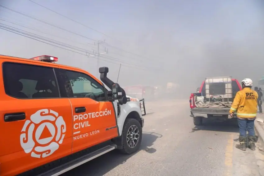 Emergency personnel and trucks at the scene of a fire near Monterrey, Nuevo Leon, Mexico.