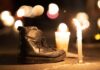 A boot next to a candle at a vigil for Mexico's disappeared