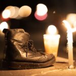 A boot next to a candle at a vigil for Mexico's disappeared