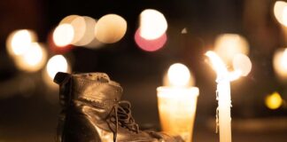 A boot next to a candle at a vigil for Mexico's disappeared
