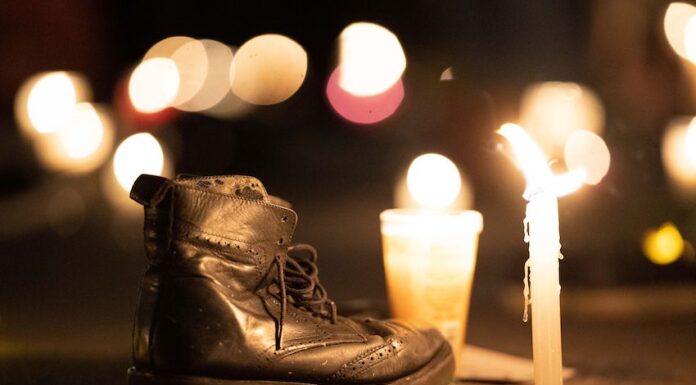 A boot next to a candle at a vigil for Mexico's disappeared